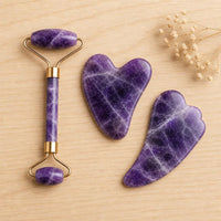 Amethyst roller and two gua sha stones flat lay