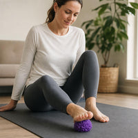 Using the massage ball on the sole of the foot